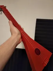 3 string ukulele-like instrument