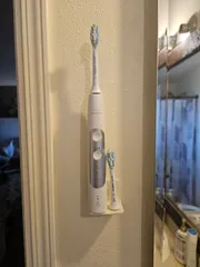 Electric toothbrush head holder