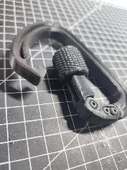Carabiner with spring loaded secured lock