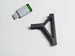 Storage hanger for flash light stand tripod