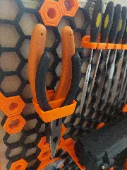 Double pliers holder for Honeycomb storage wall