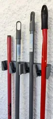 Triple & quadruple gravity broom holder + gear for smaller diameter broom sticks