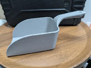 Rectangular bowl shaped scoop with handle
