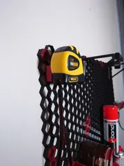 Honeycomb storage wall tape measure holder