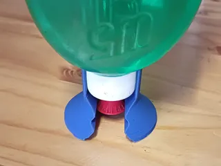 Upside down dishwashing liquid holder