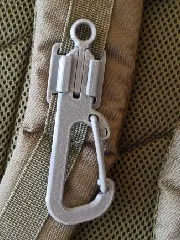 QUICK-CLIP system carabiner for a backpack