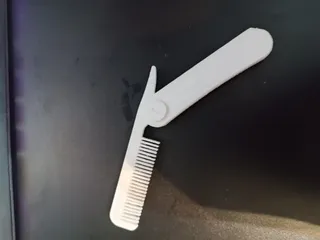 FOLDING COMB