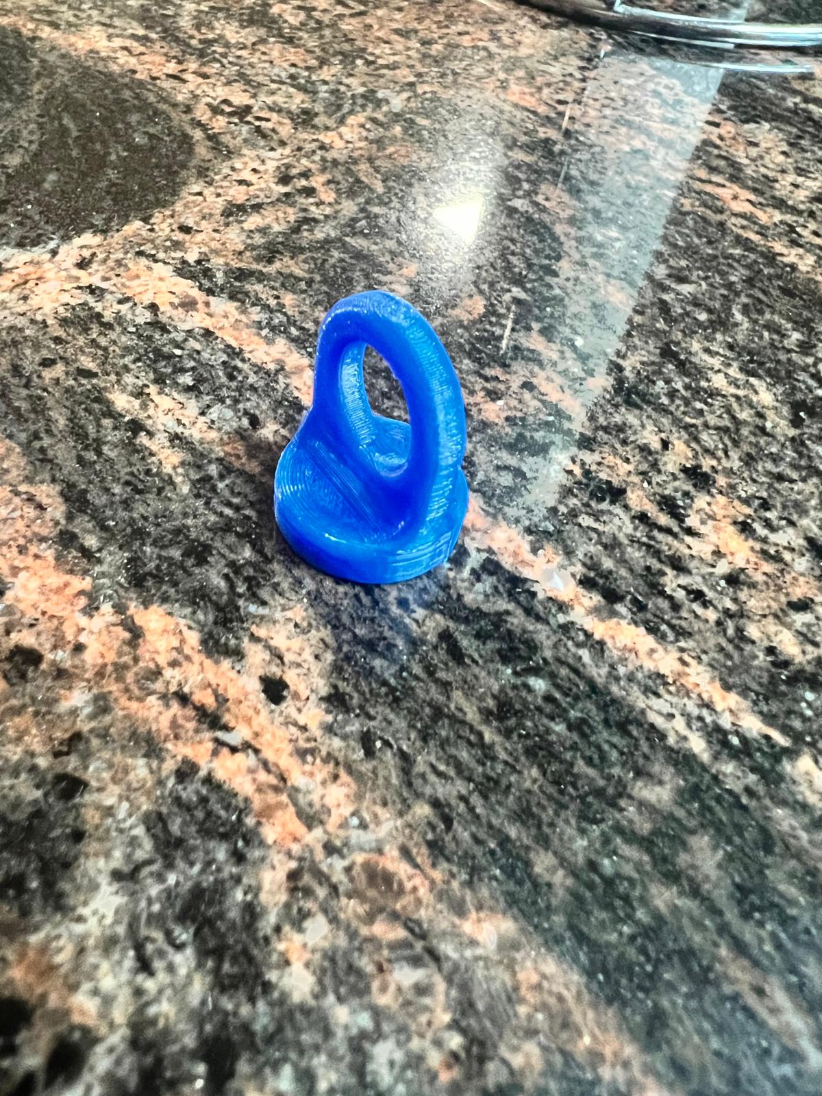 Magnetic hanging loop for dishwashing brush