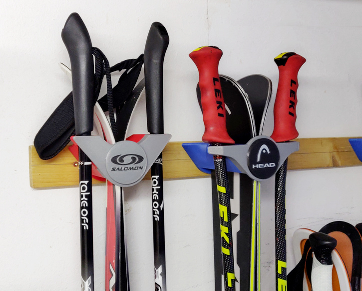 Designer wall mount for storing cross-country skis and ski poles with logo/nameplate