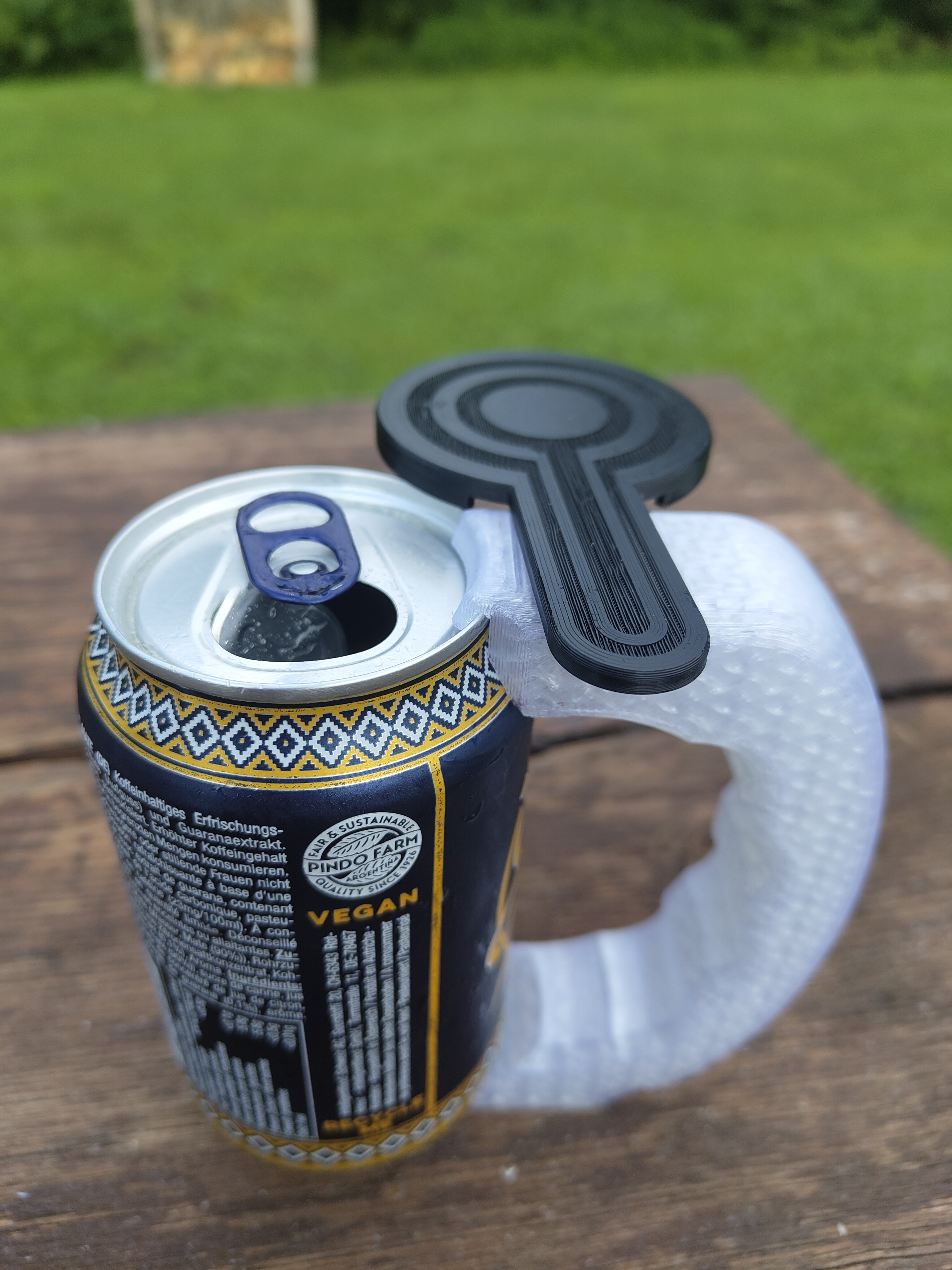 Can holder for 330 ml cans with rotating protection lid – easy print