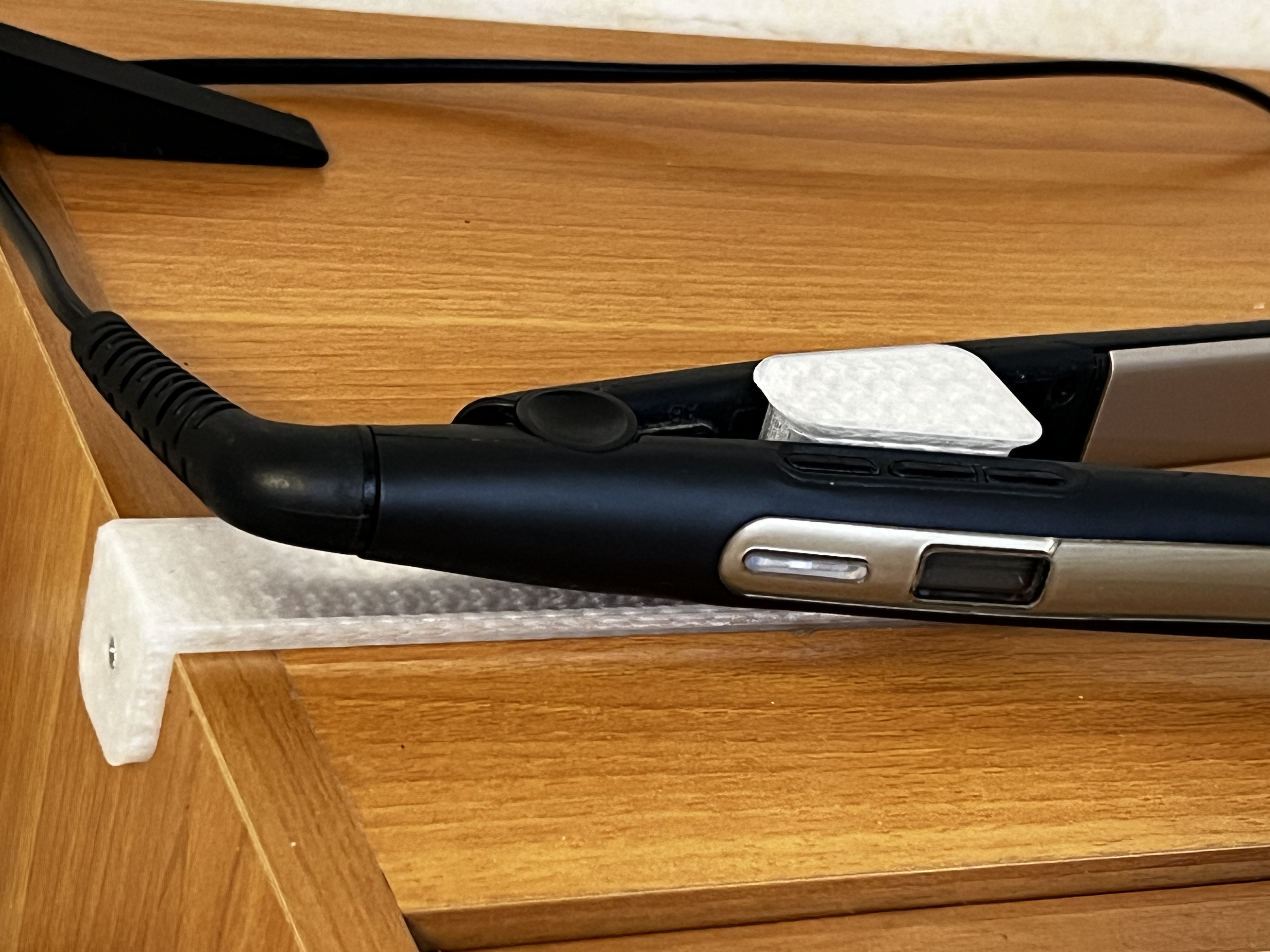 Hair straightener holder with top screw