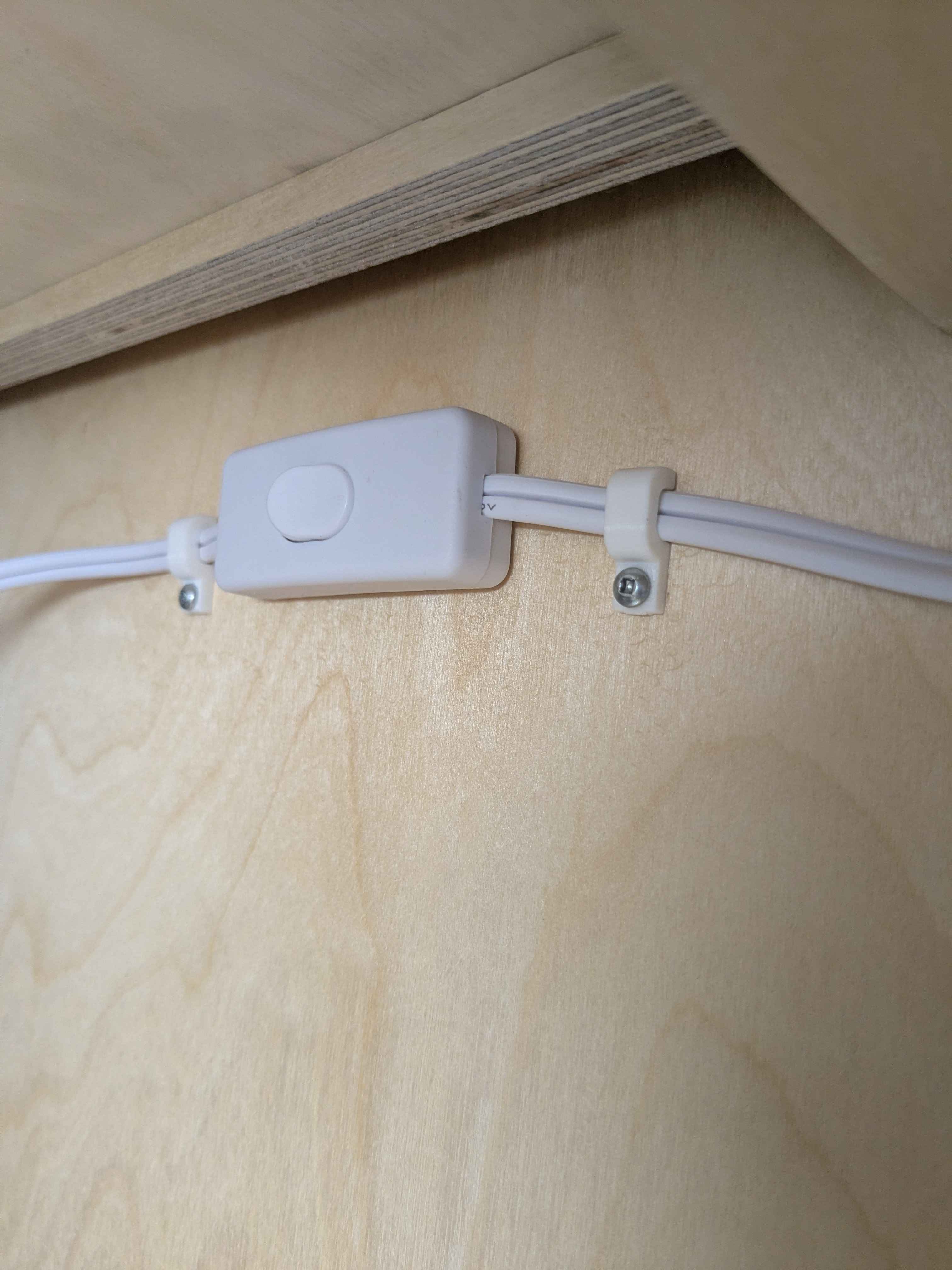 Screwed lamp cord clip