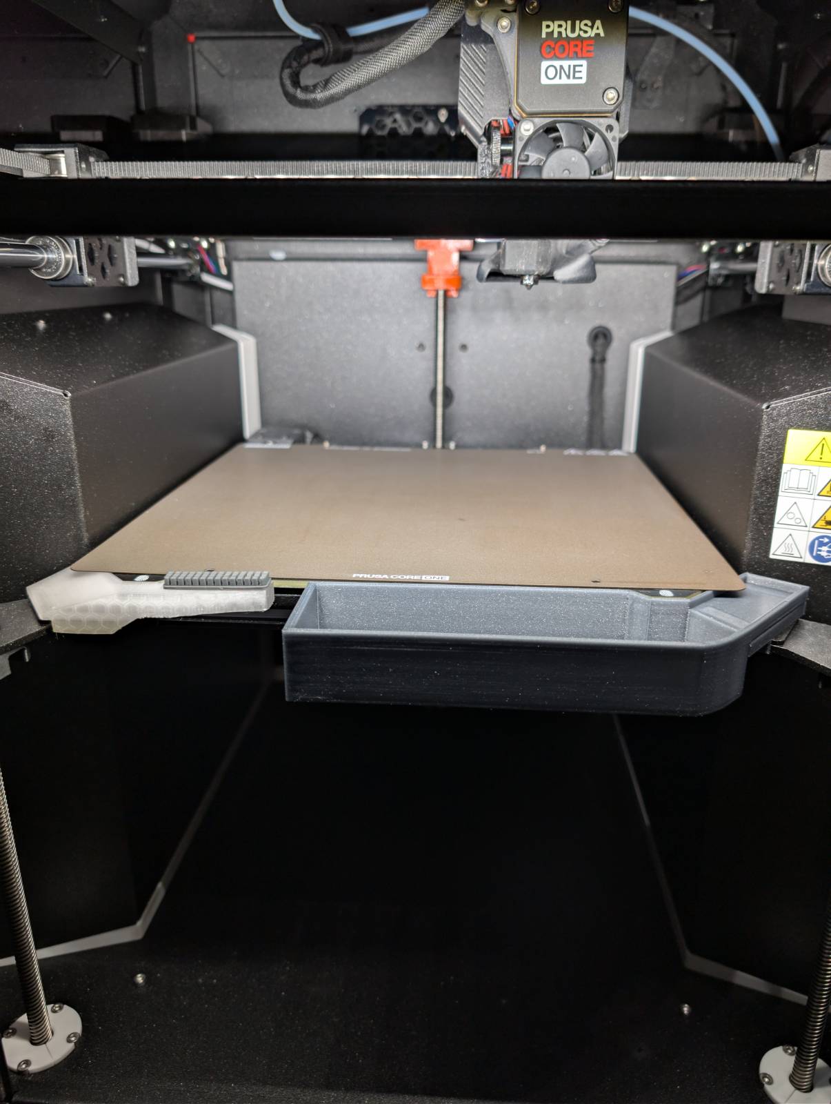 Bed-mounted purge bin for the Core ONE