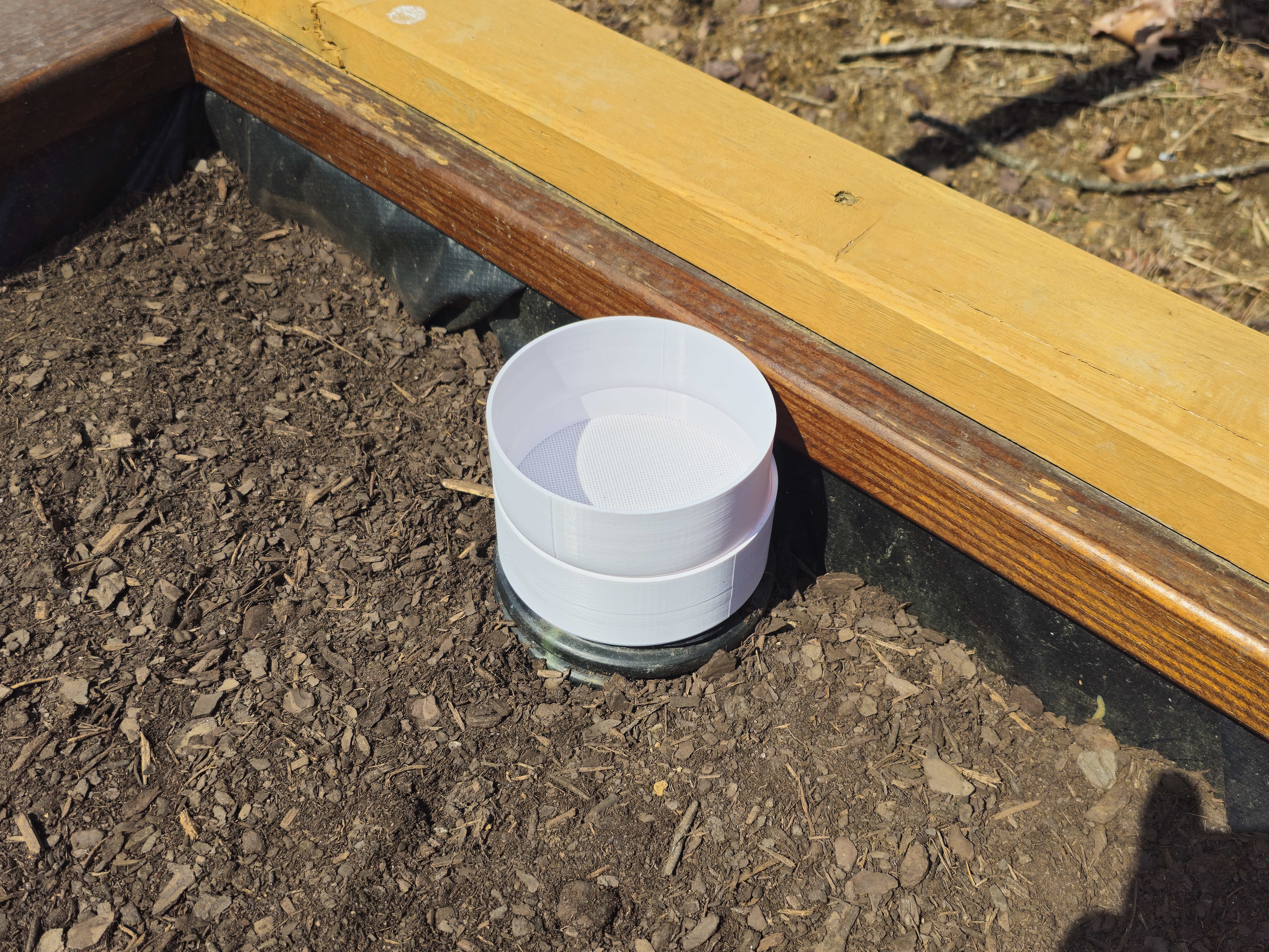 Corrugated Pipe Insert for Self-Irrigating Planter Bed