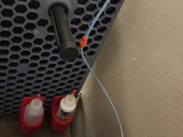 Magnetic coupler for reverse bowden PTFE tube