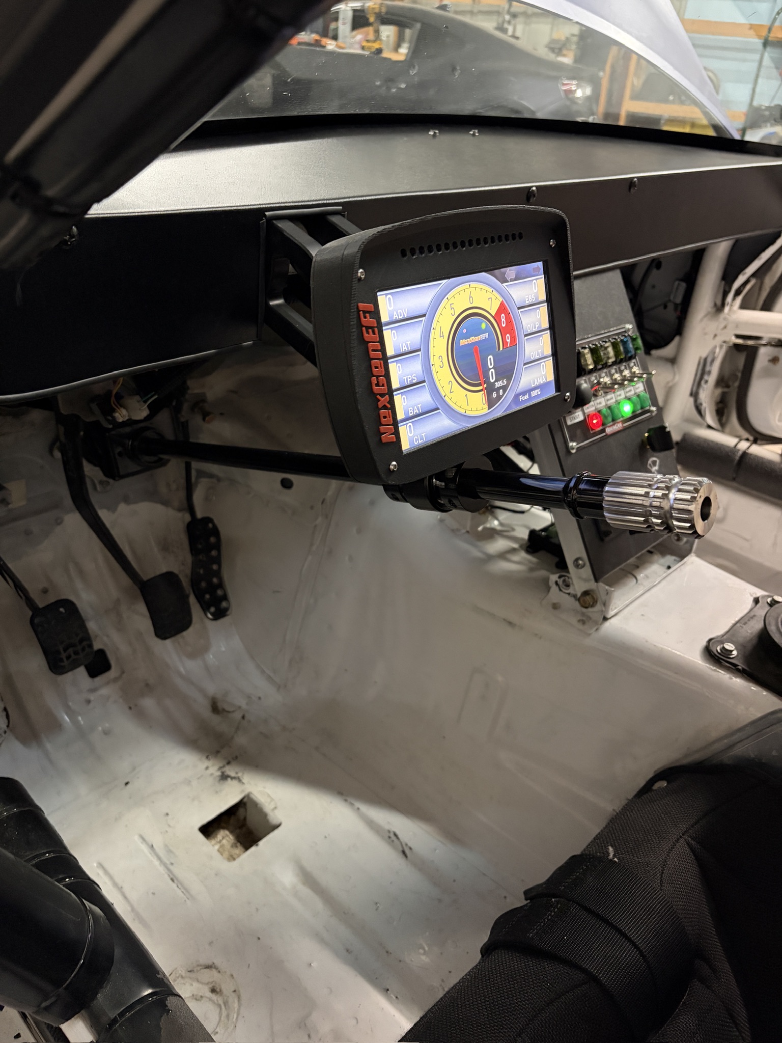 Race car gauge cluster steering column mount for nexgenefi display