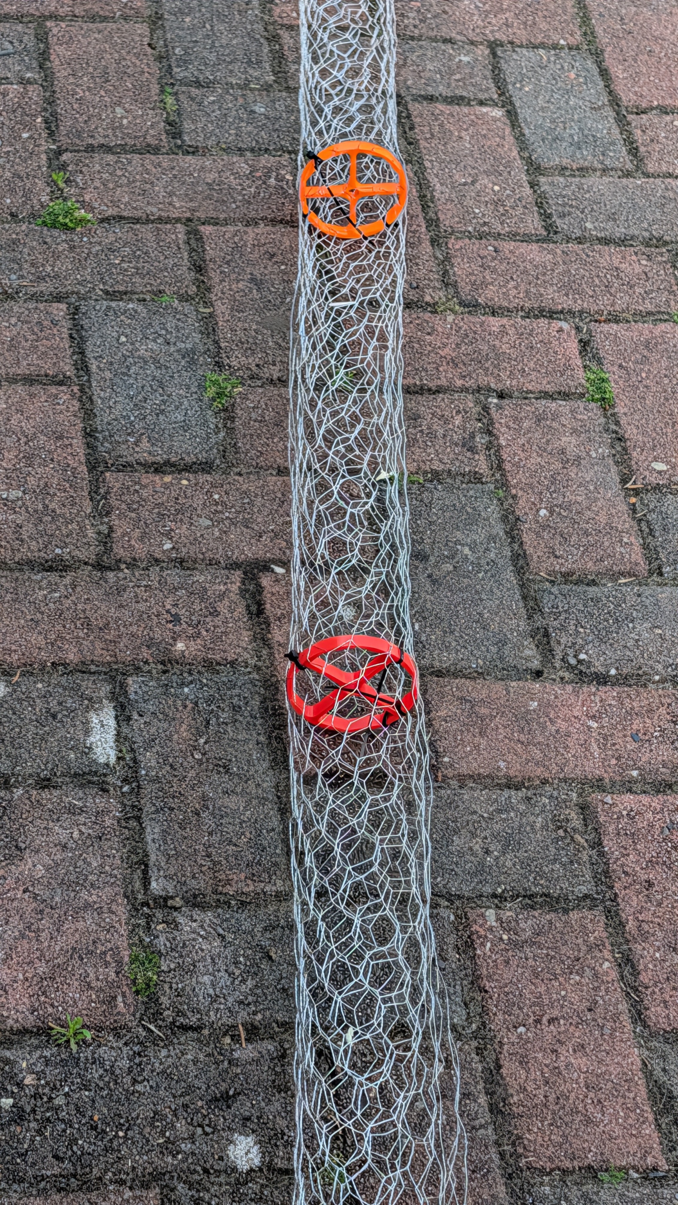 Gutter guard made from chicken wire and cable ties.