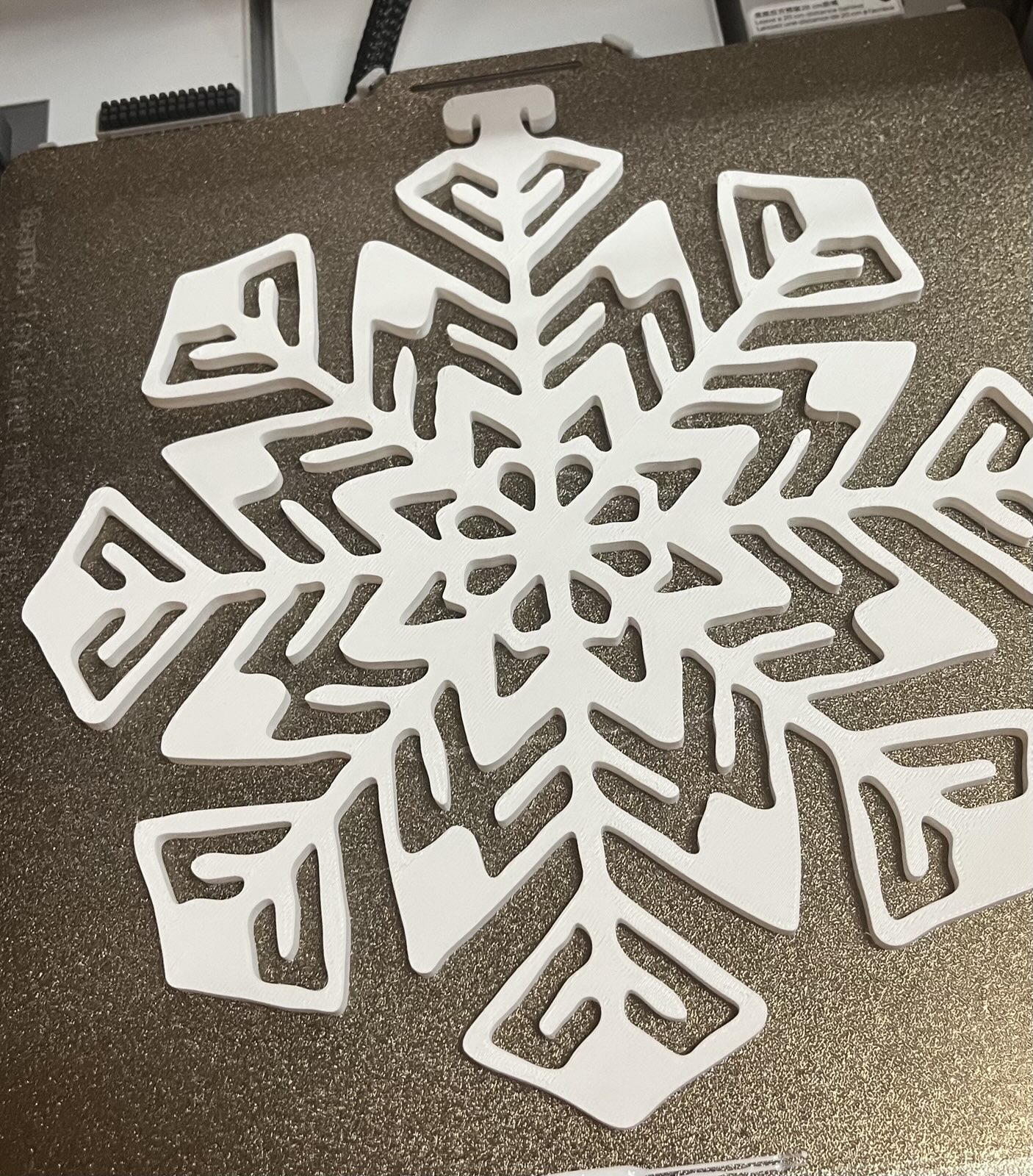 The Four Snowflakes from the other model but with better hooks and included an OrcaSlicer 3mf file with correctly sized plates for 245mm max dimension and 5mm height