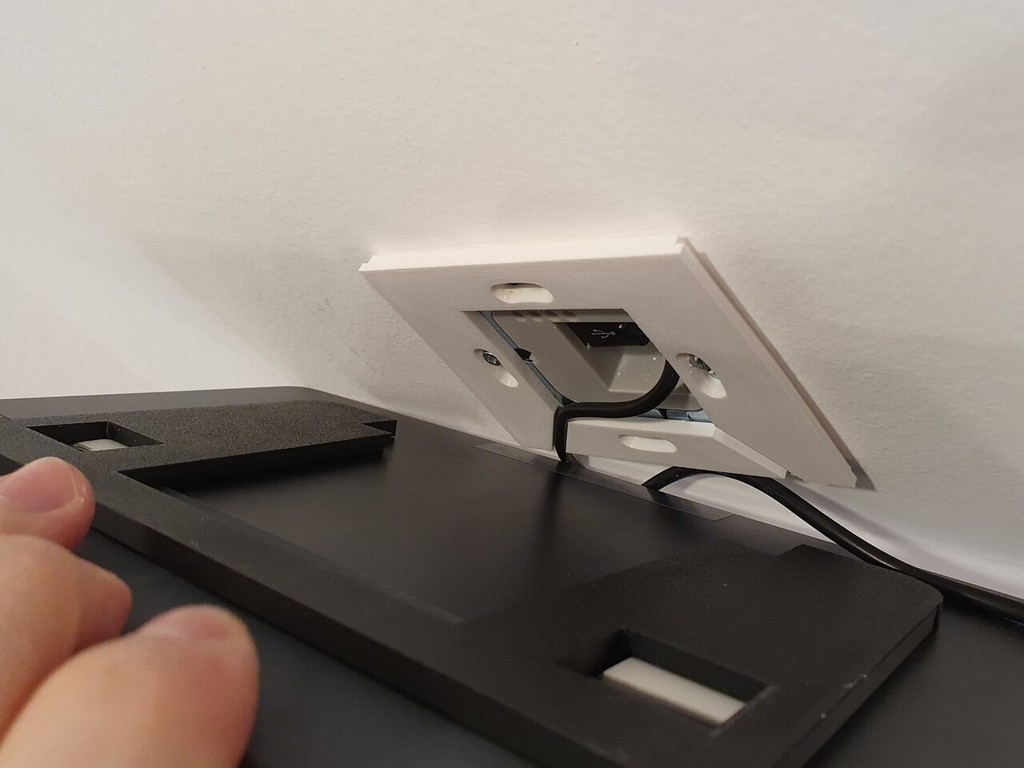 Floating tablet wall mount with charger support by Hans Schulz
