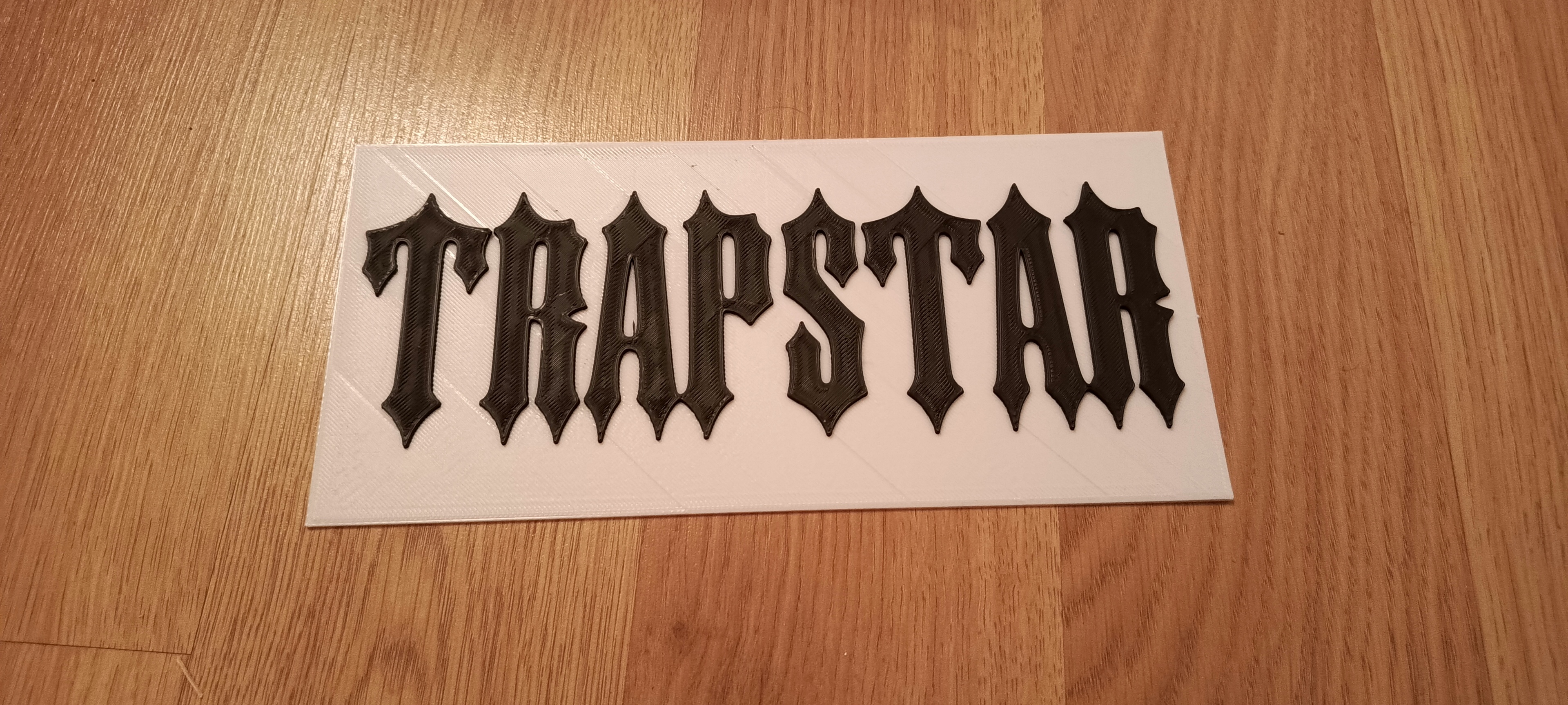 Trapstar logo sign