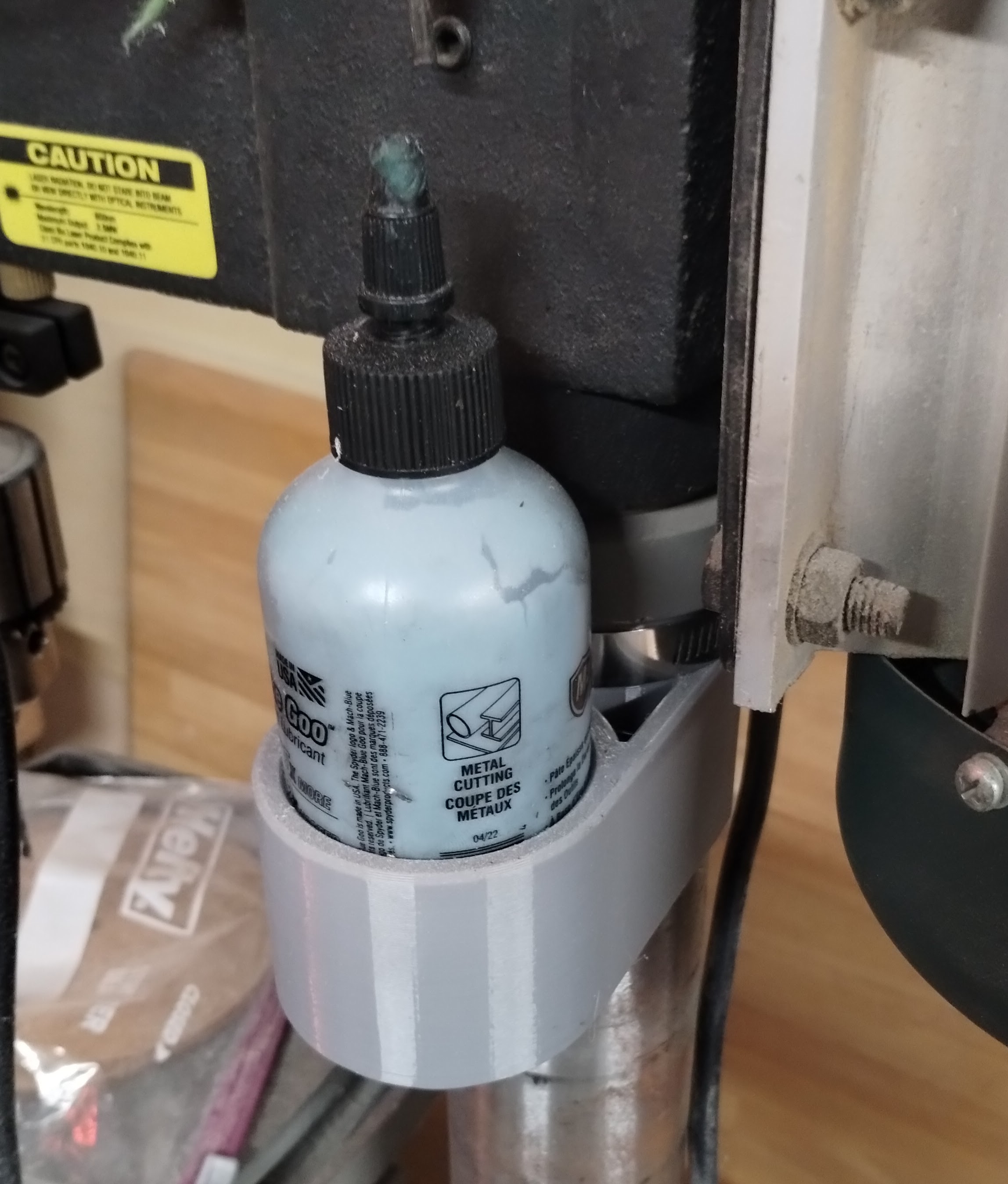 Cutting oil bottle holders for drill press