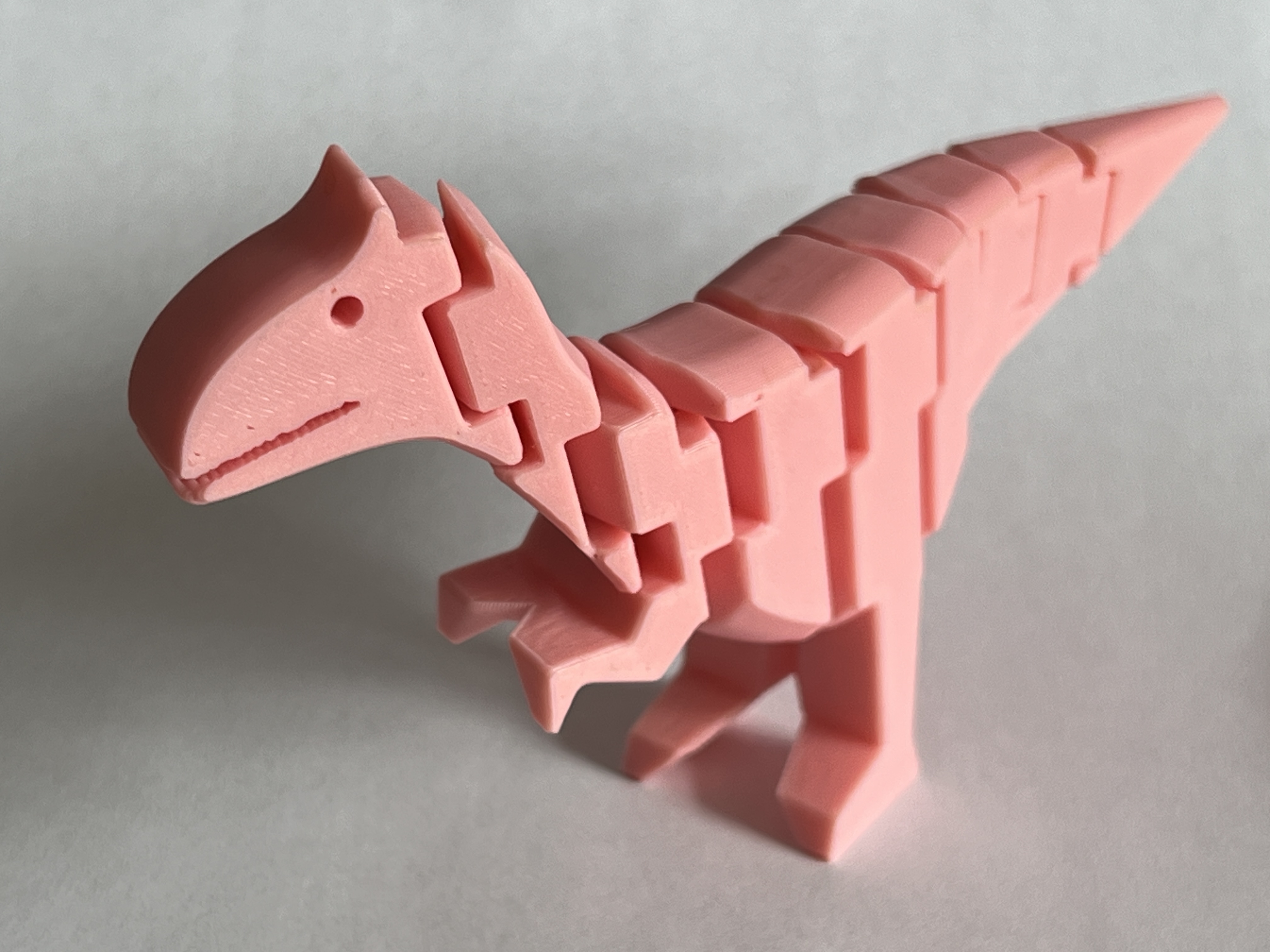 Elvis, the Flexible Cryolophosaurus Print in Place Dinosaur. Pink like Elvis' 1955 Cadillac.