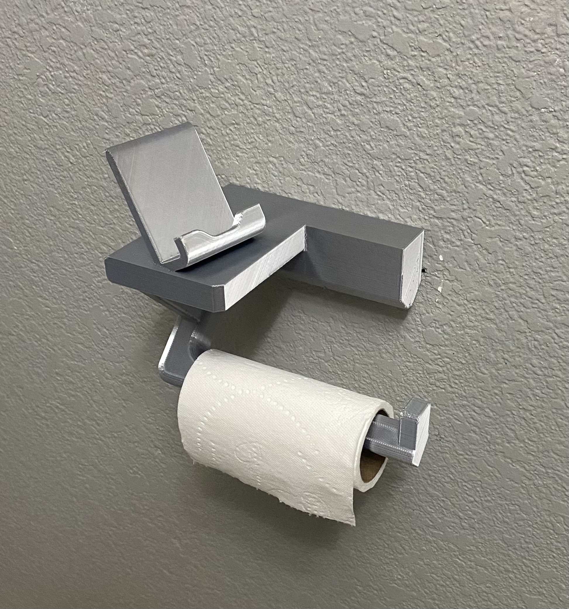 Toliet Paper Roll holder with phone stand.