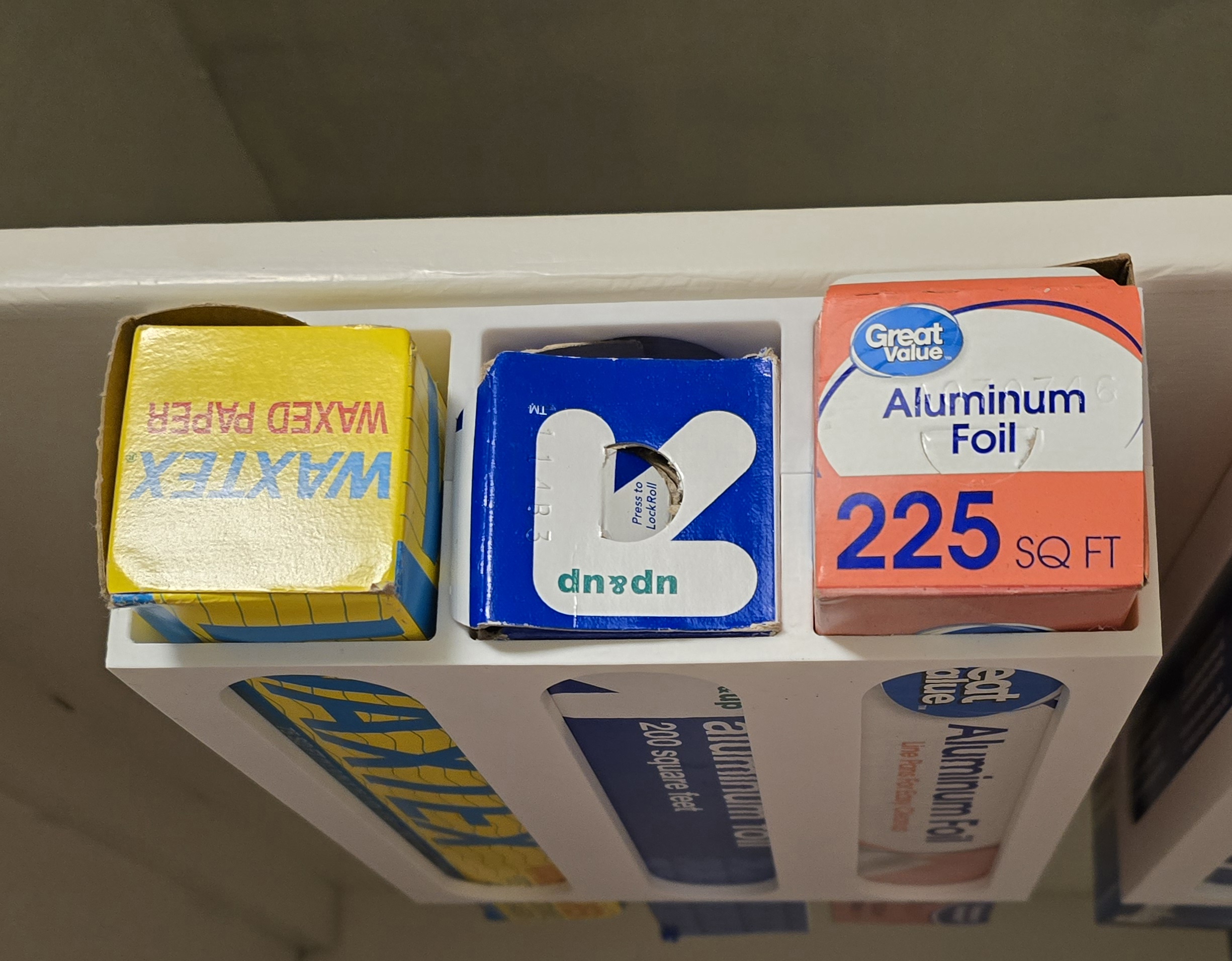 Under-shelf foil / rolled kitchen stuff holder