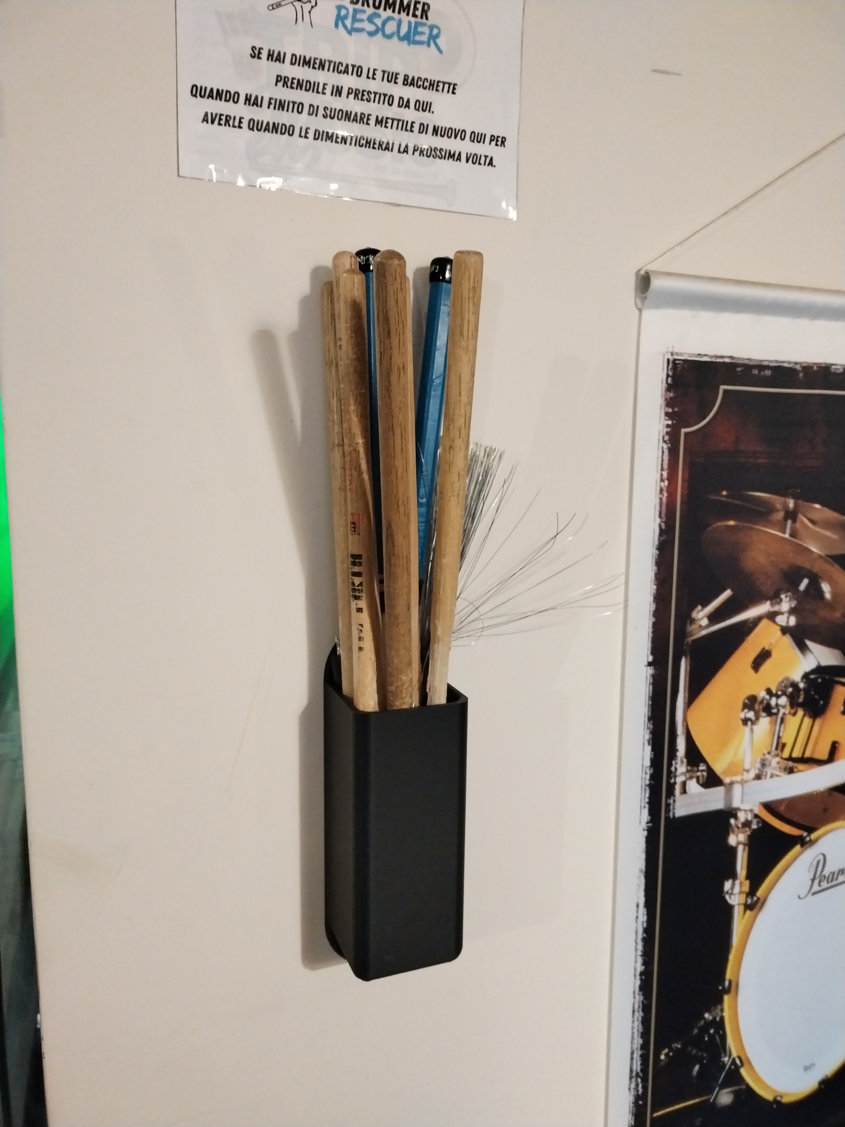 Wall mounted drumstick holder