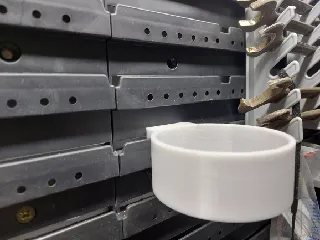 Držák nádobky na šroubky
