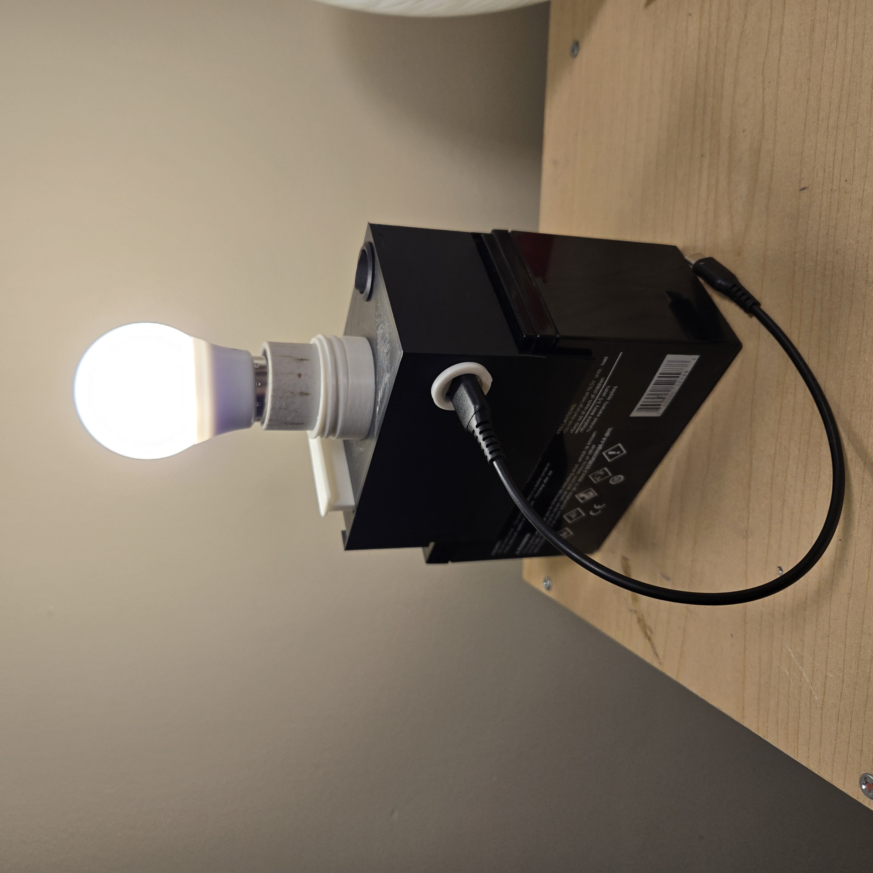 Portable Light and USB Charger station, powered by small Lead Acid battery, may be useful in a poor area