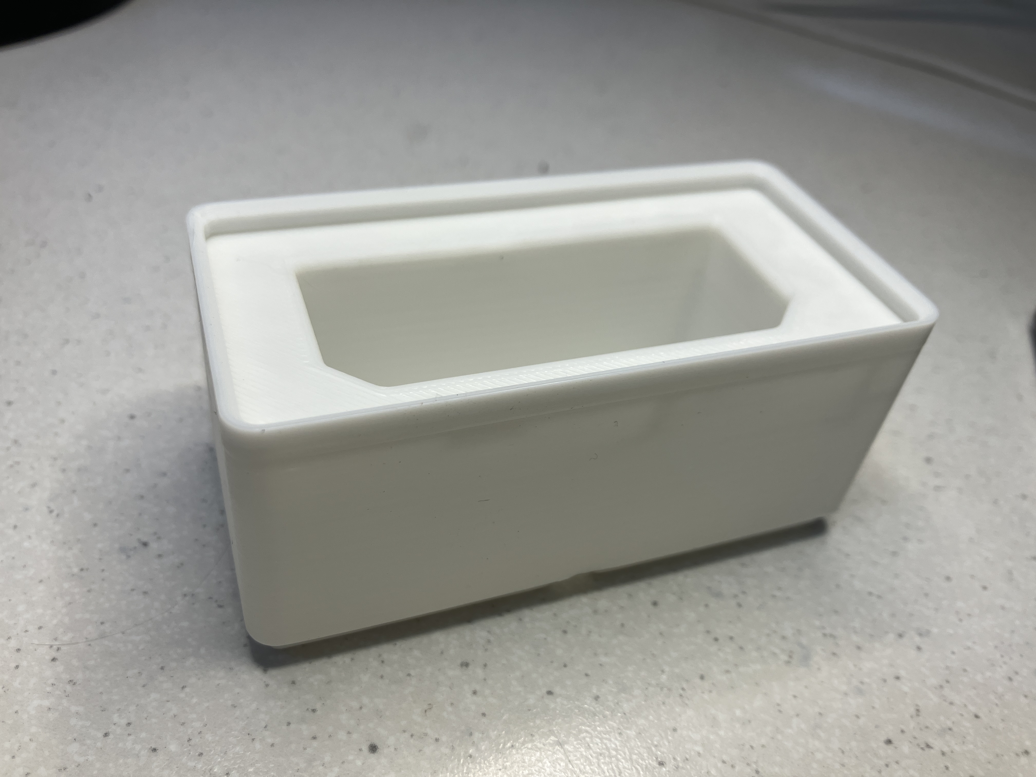 A Gridfinity case to hold a Godox V860ii battery.