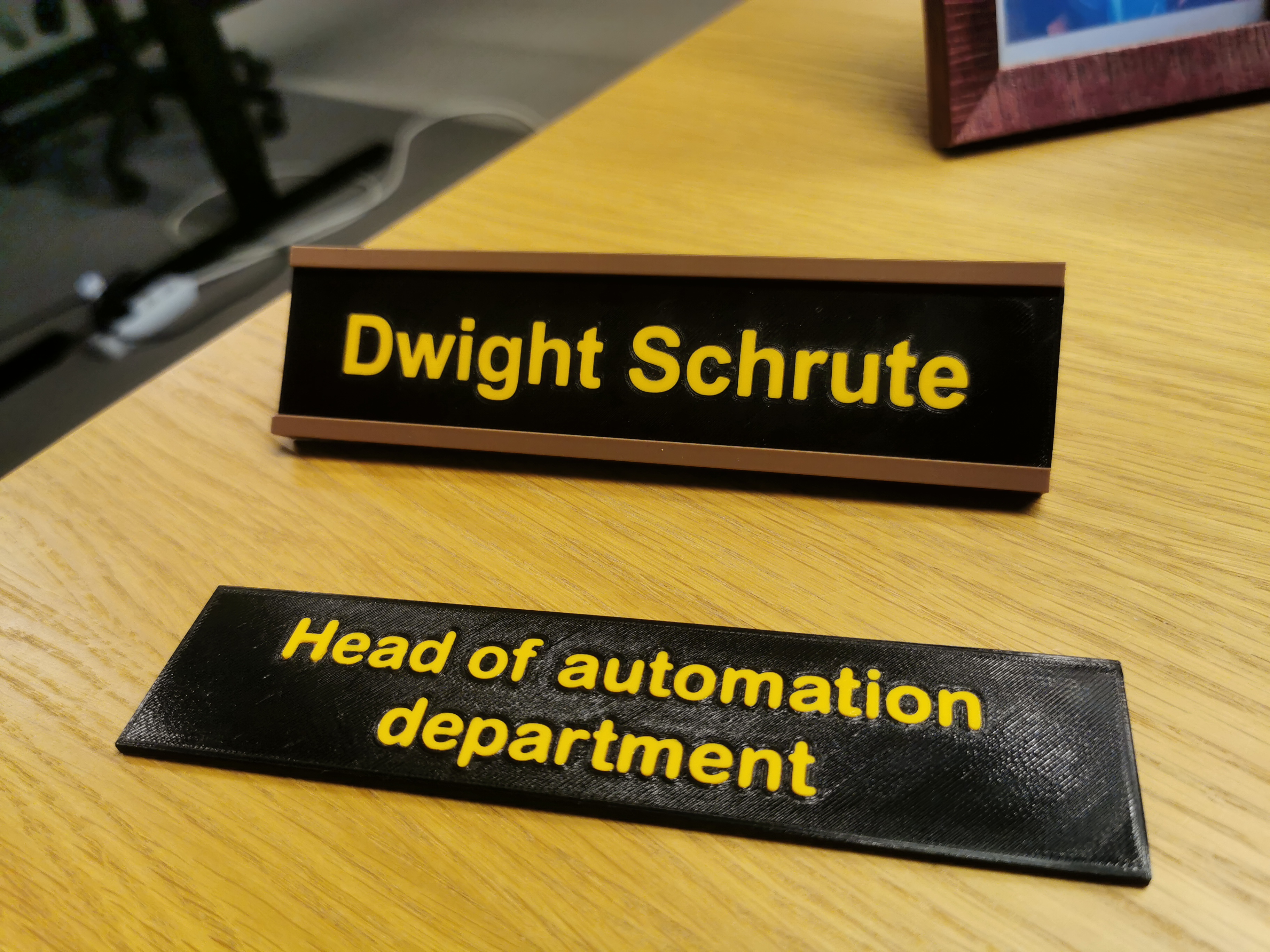 Name plate with a holder
