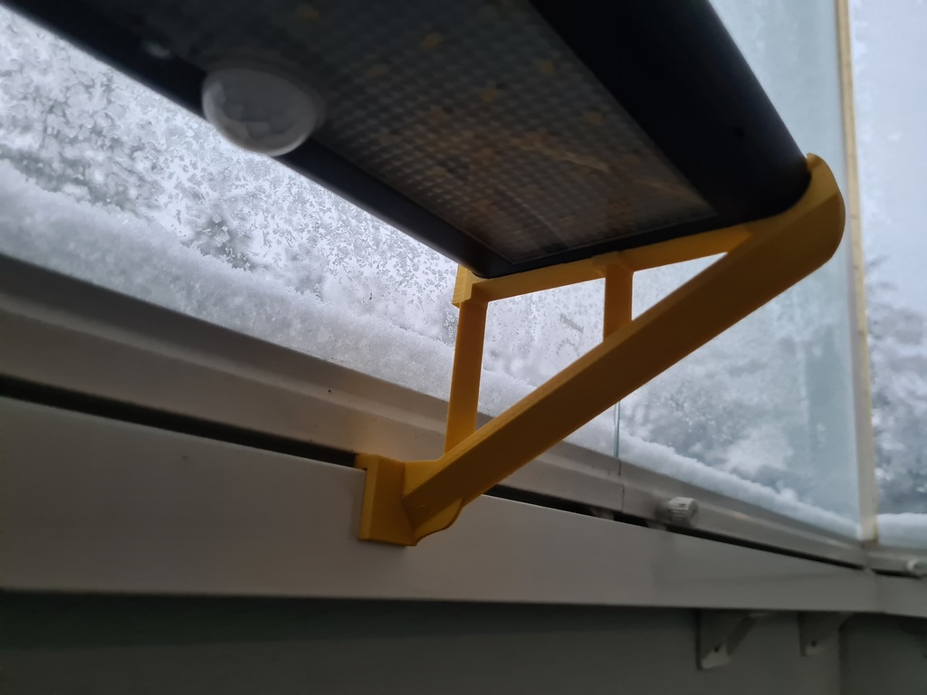 Balcony windowframe holder for solar panel light