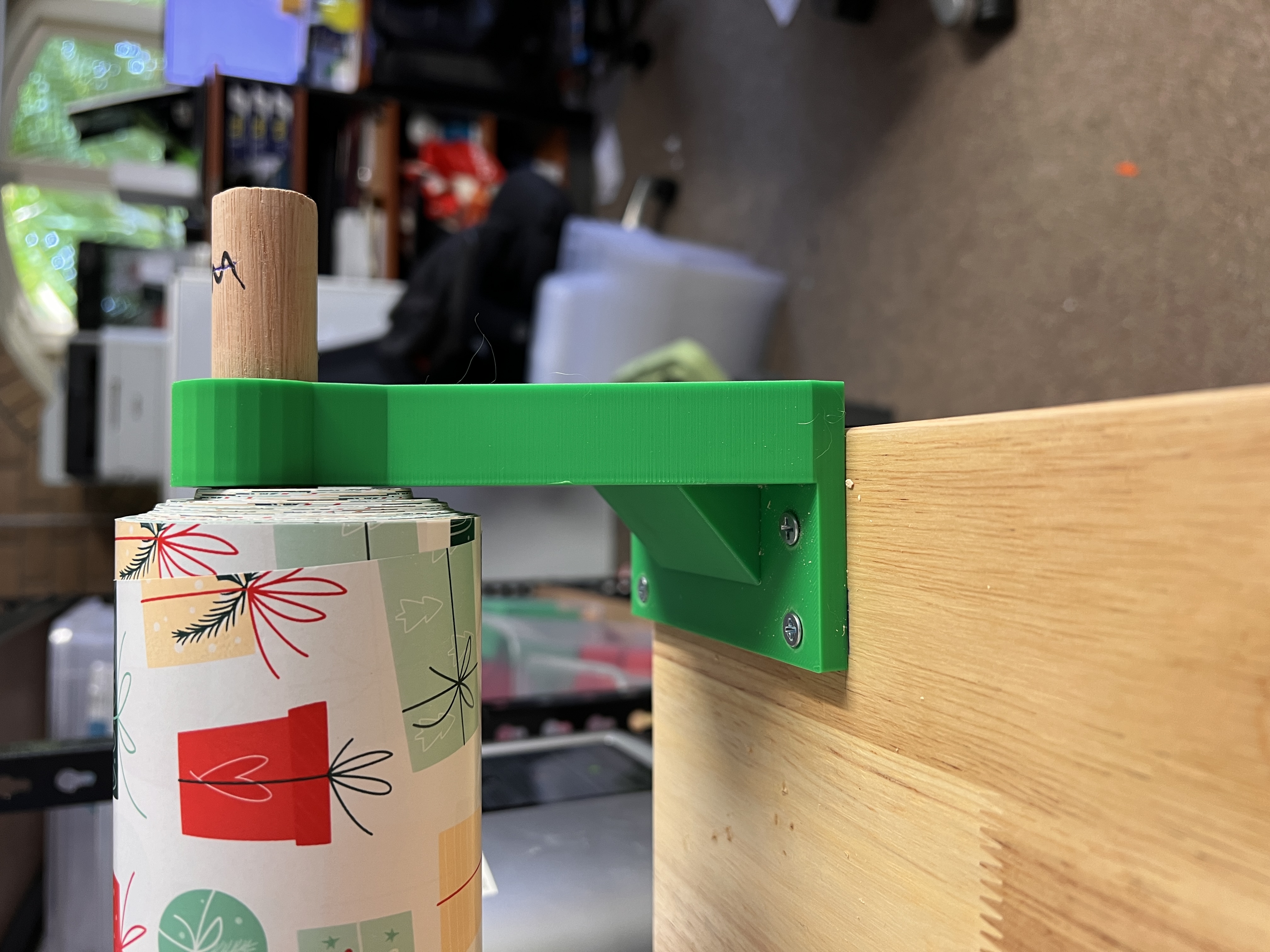 Wrapping paper roll bracket