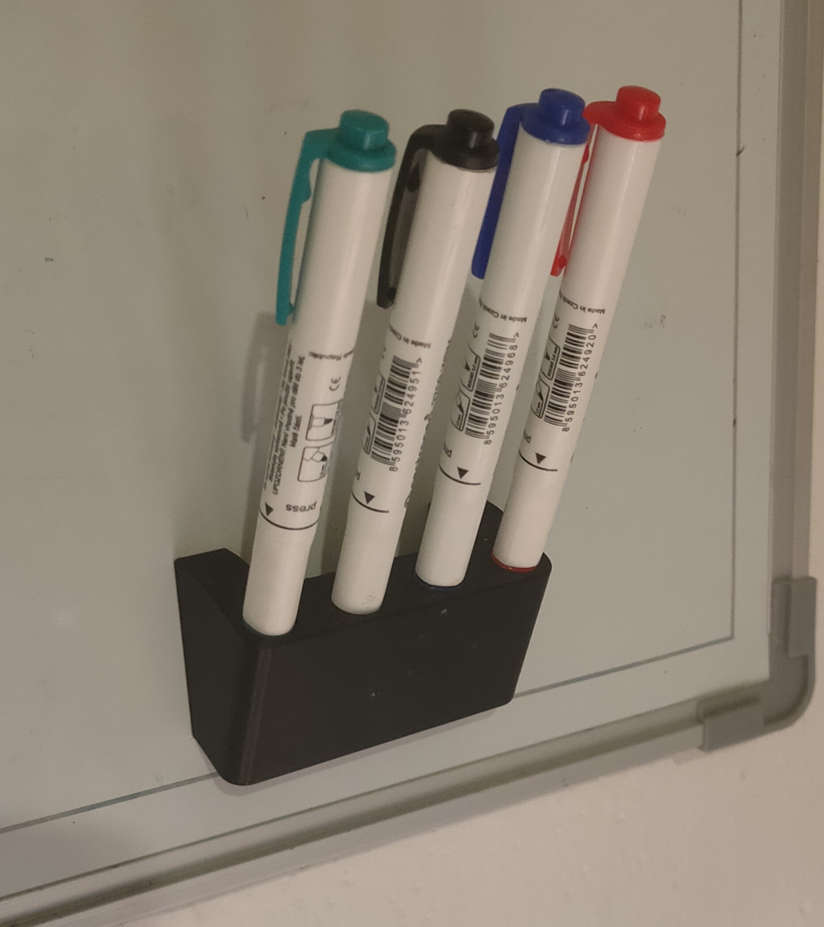Magnetic board marker holder