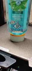 Shampoo bottle holder