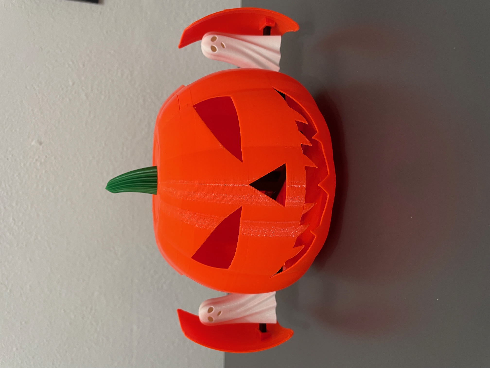 Halloween pumpkin with sliding ghosts