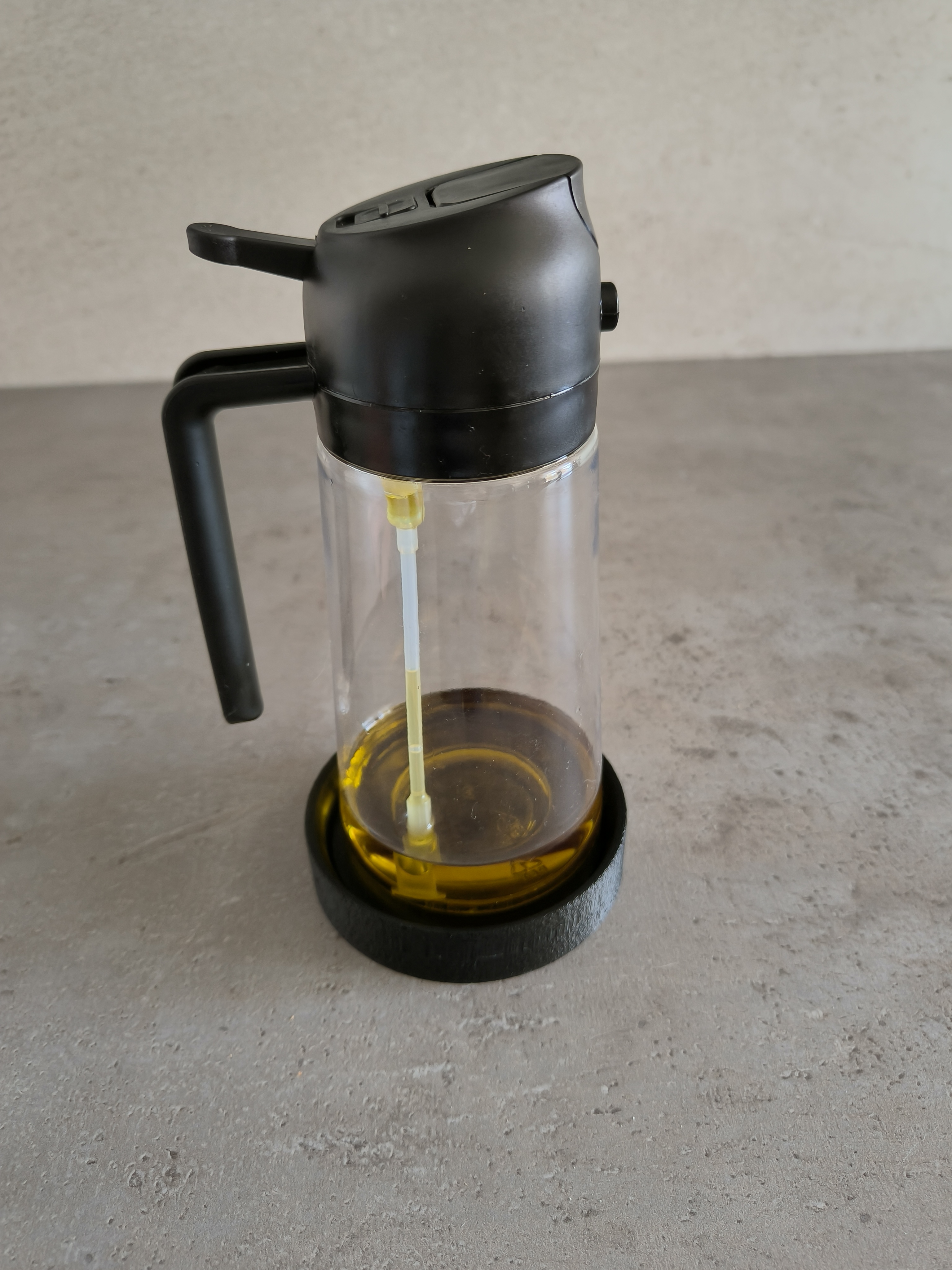 Viral oil dispenser holder