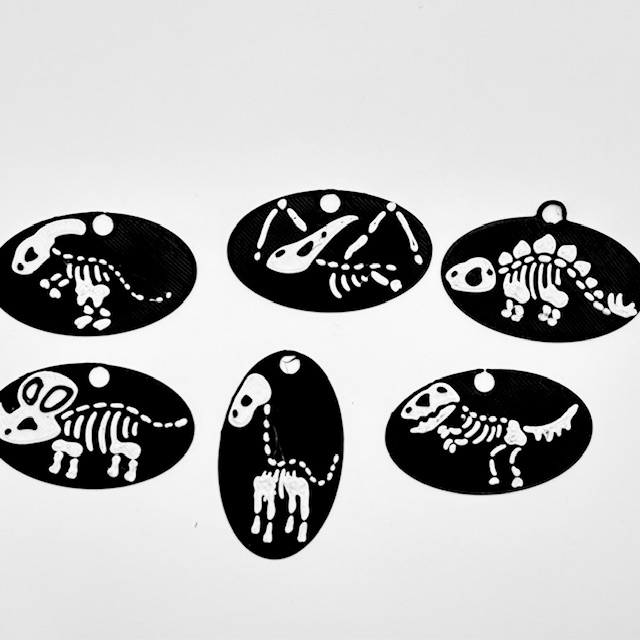Dino Skeleton Earrings by ChrisDGT Download free STL model