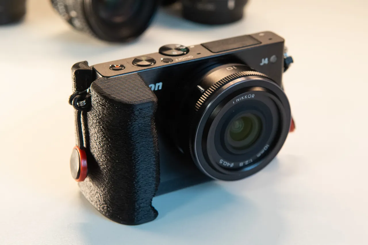 Nikon 1 J4 Grip by Matzetas | Download free STL model | Printables.com