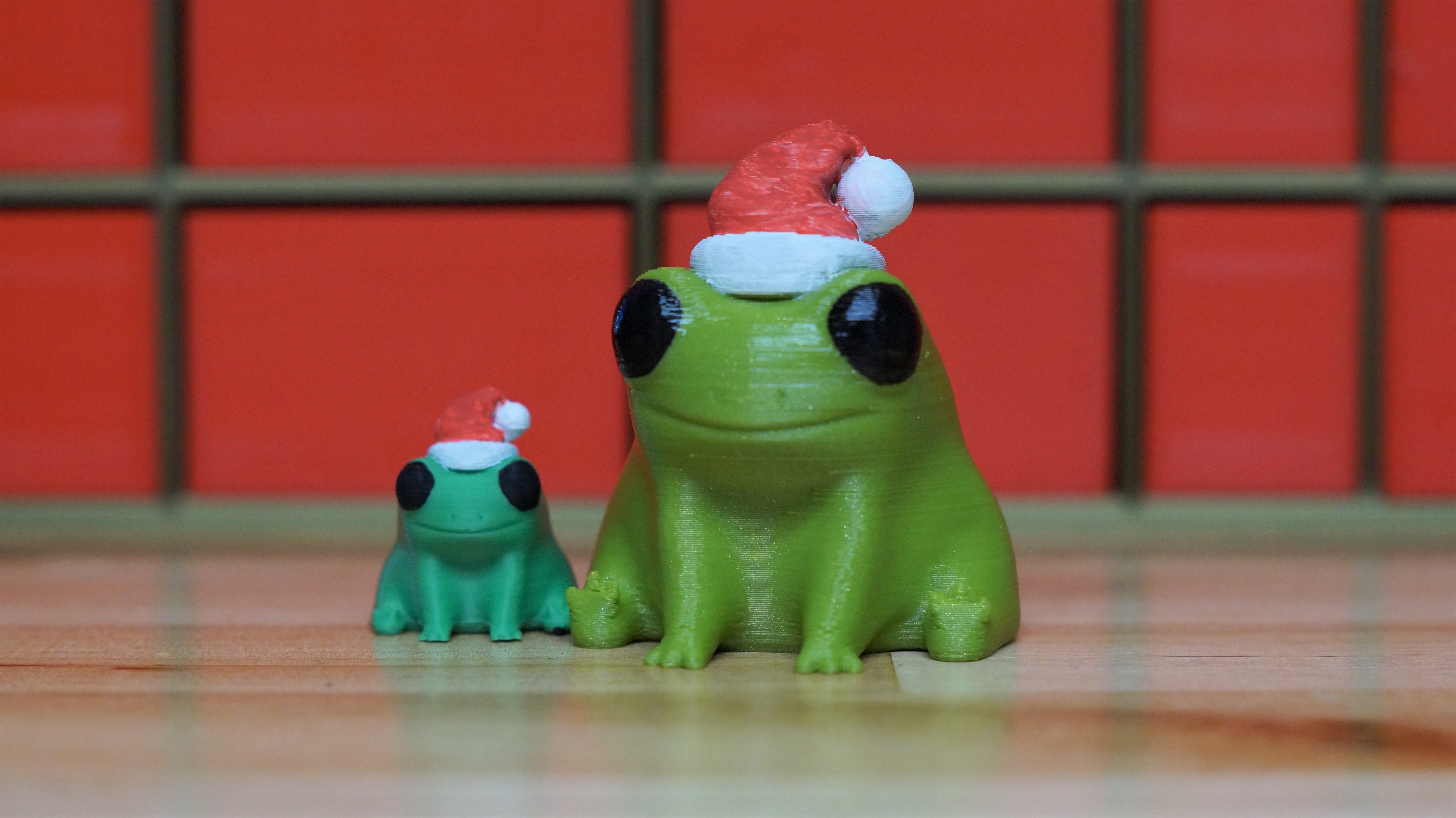 Fred the Frog but he's wearing a Santa Hat