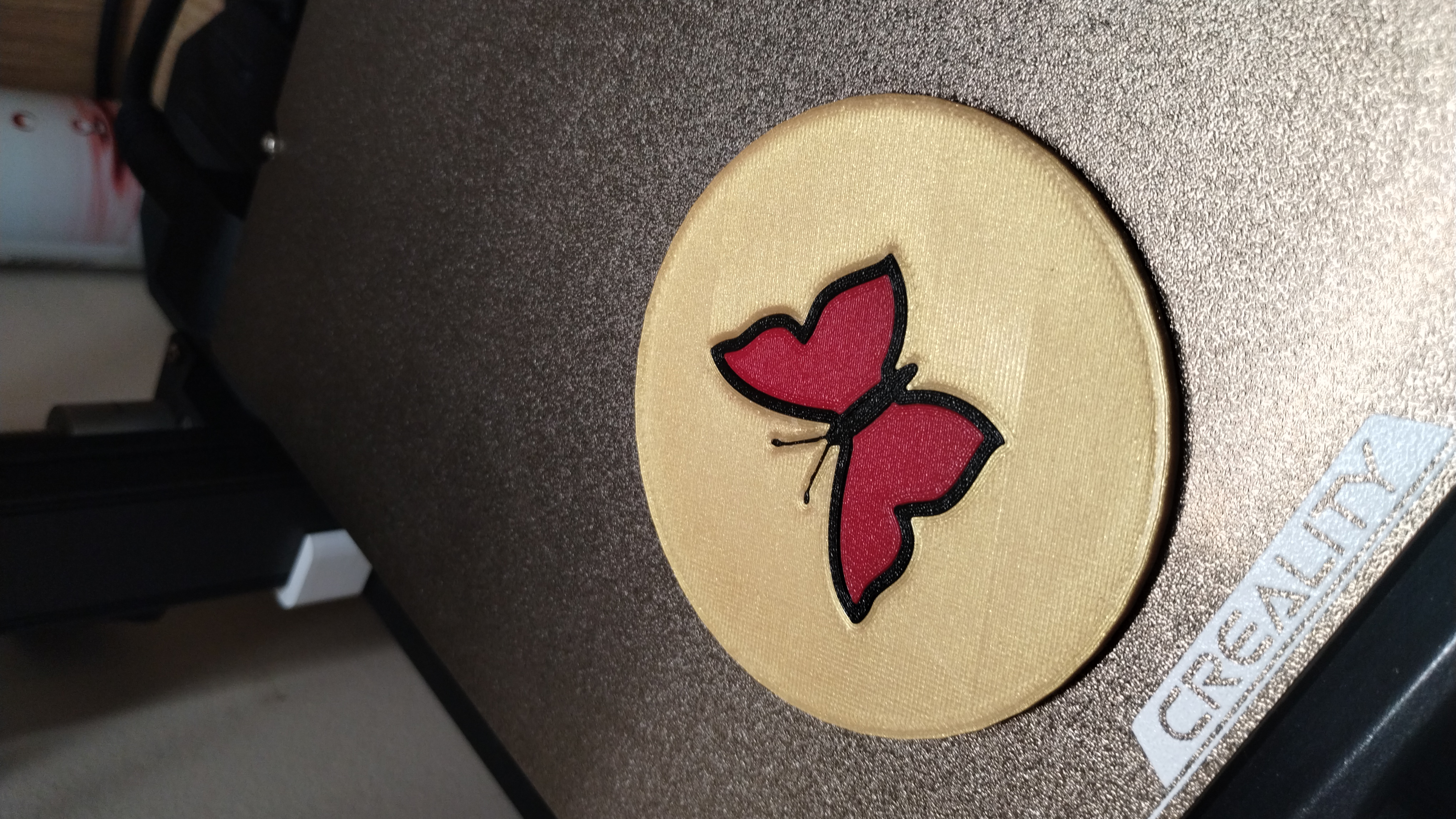 A mug coaster with a butterfly
