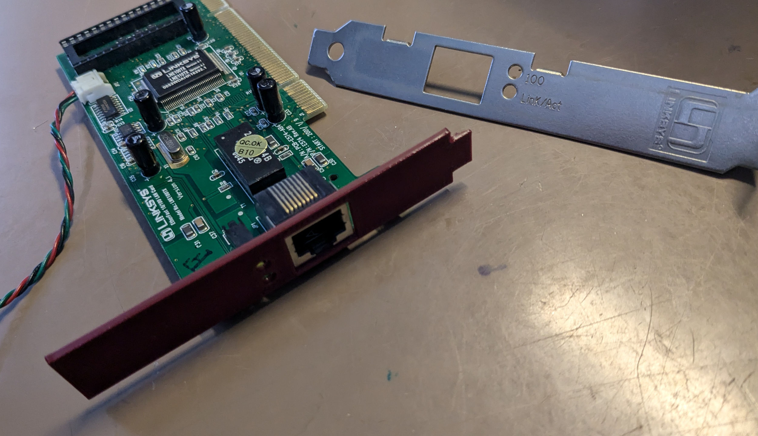 Linksys LNE100TX or HP5064-6057 half-height bracket