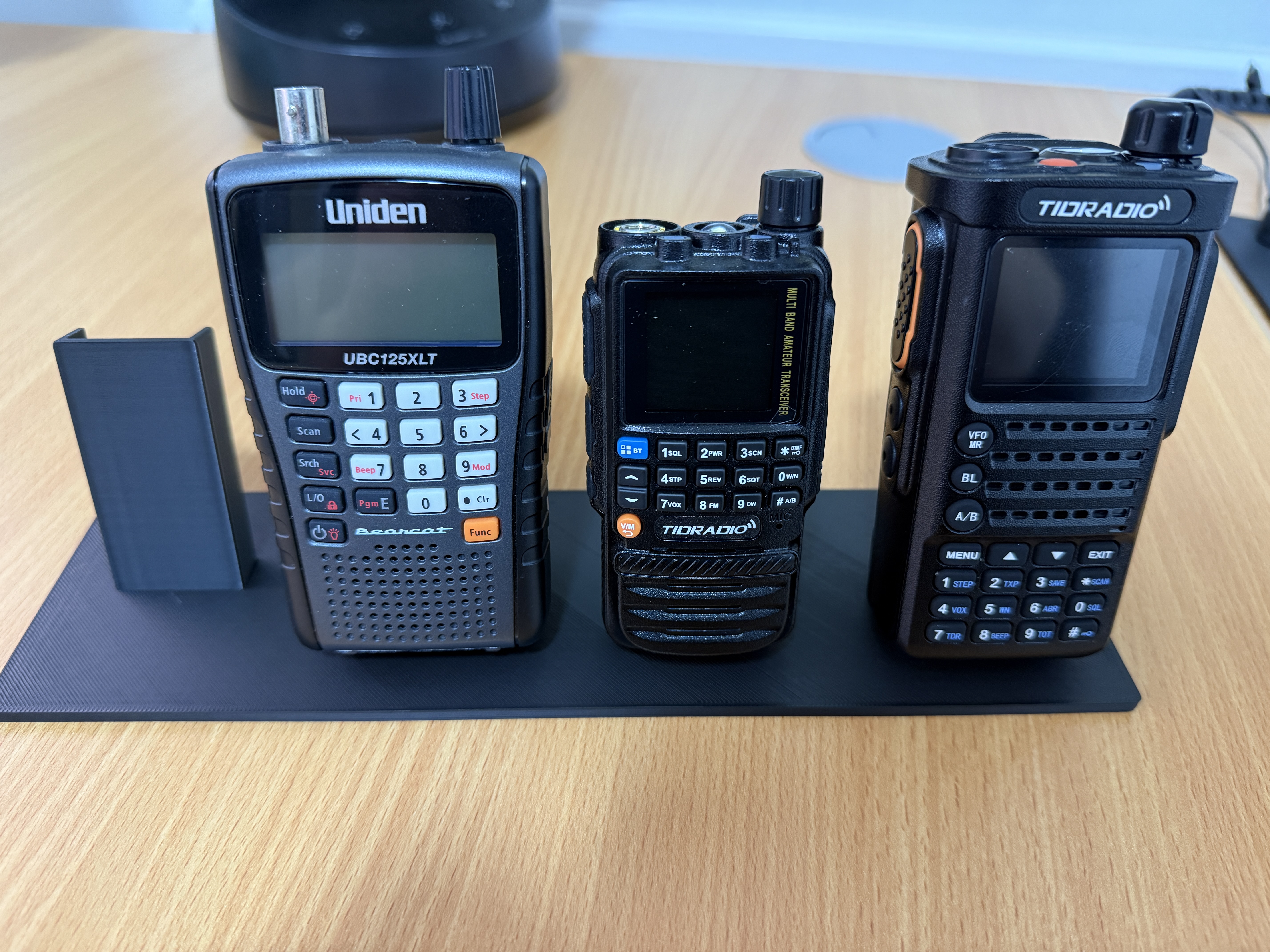 Stand for four handheld scanner or two-way radio devices
