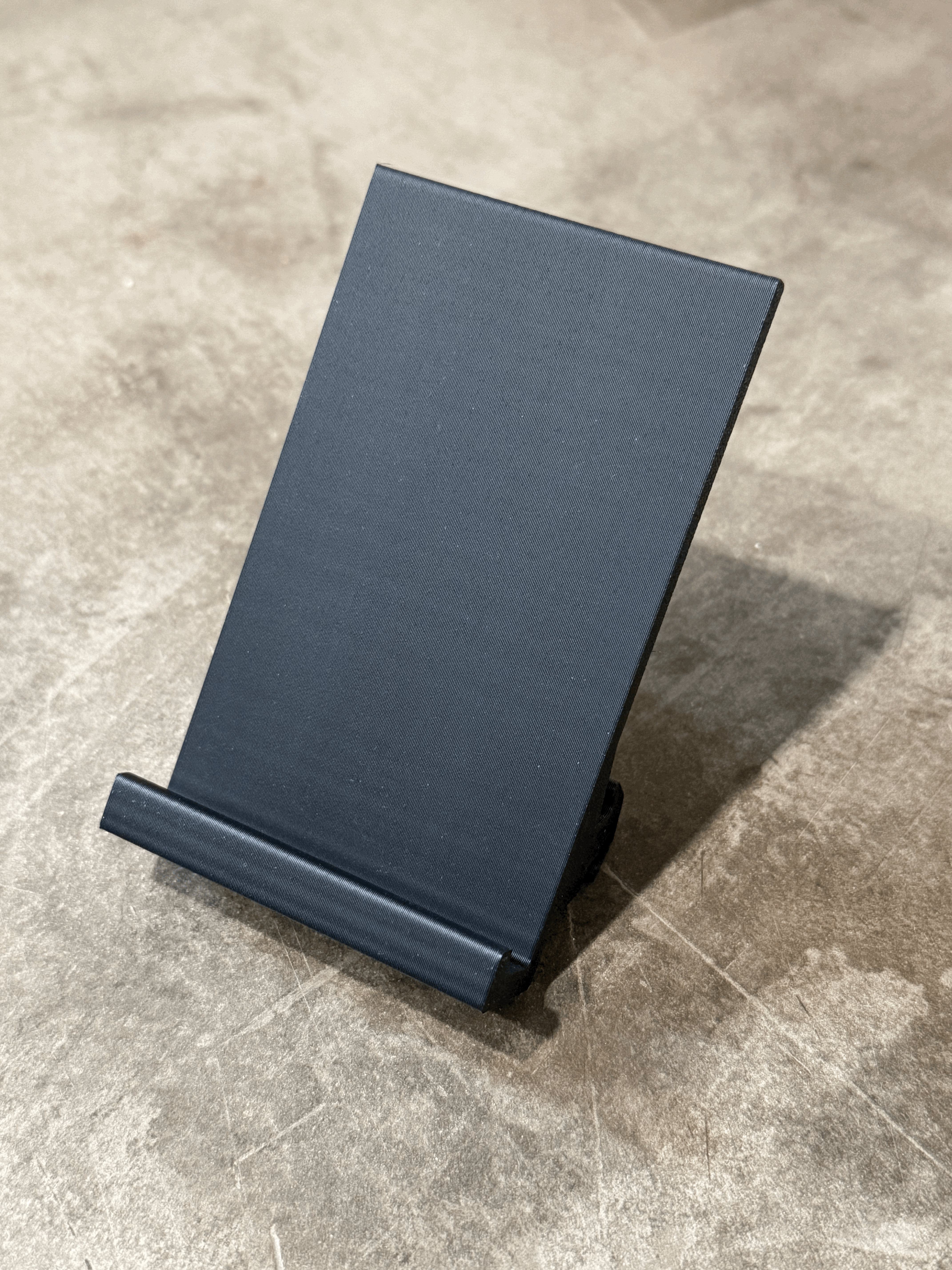 Aluminum extrusion smartphone stand.