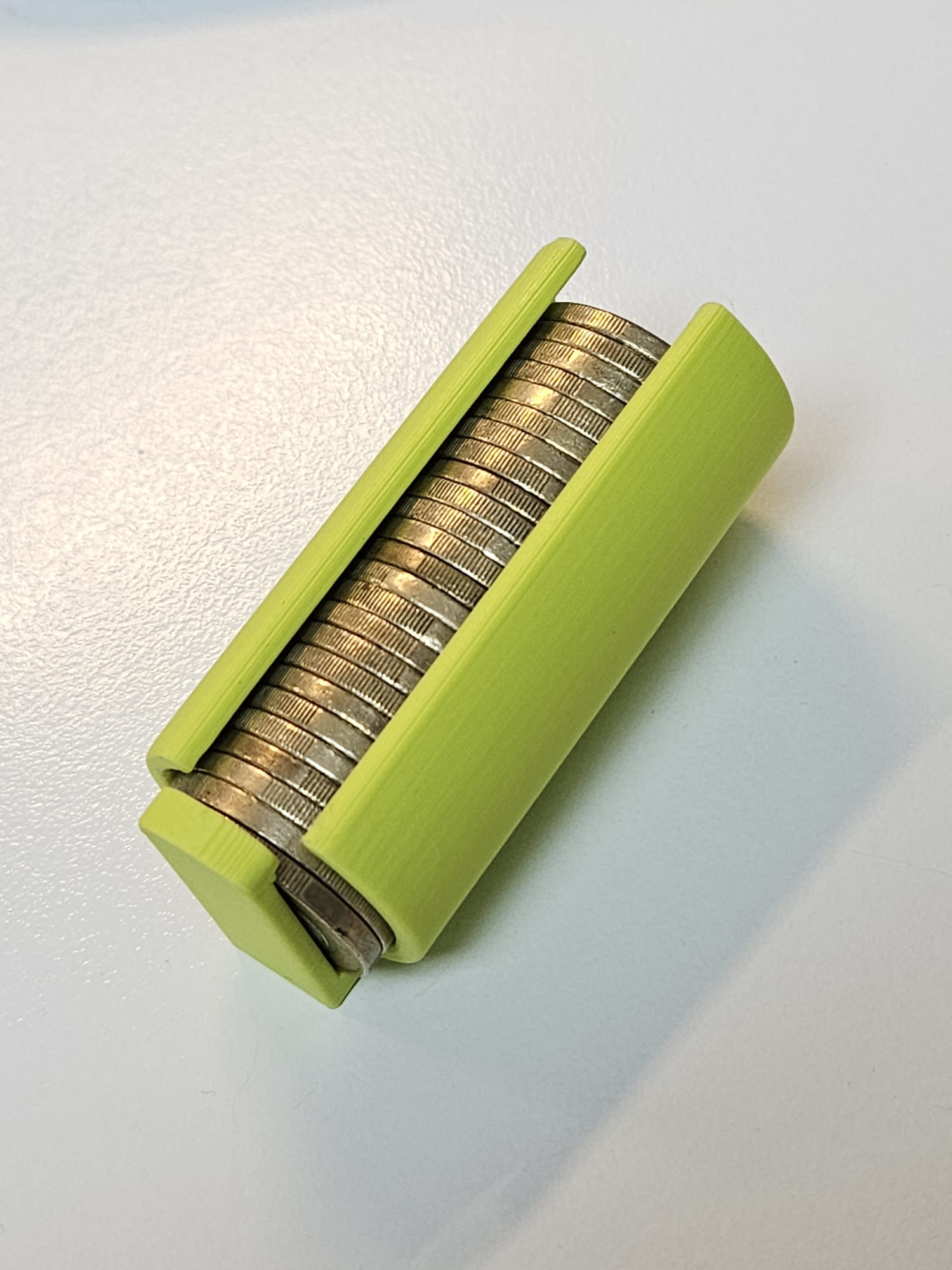 Coin dispenser for wall mounting with drop-out protection