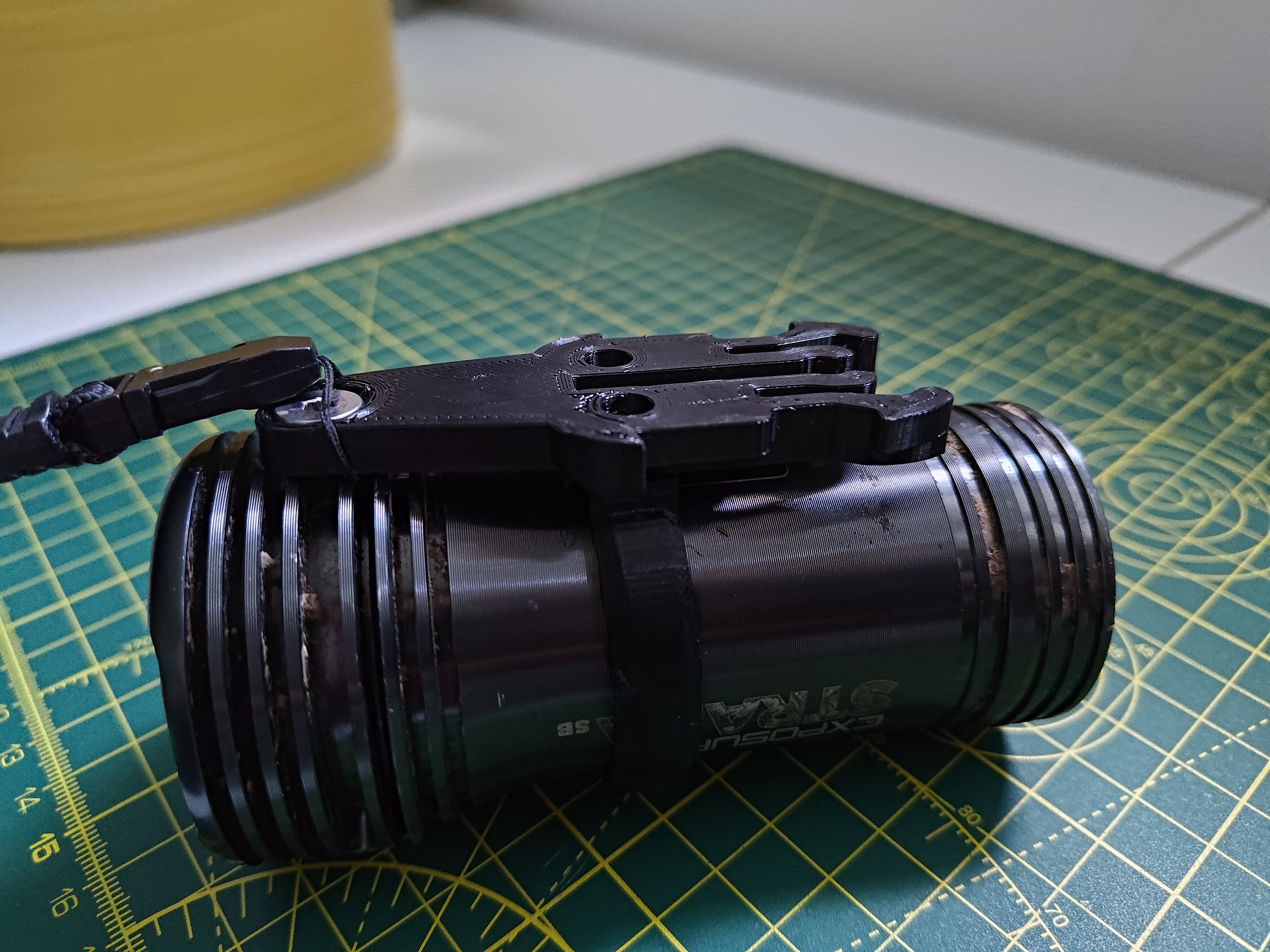 Exposure light to go-pro buckle mount