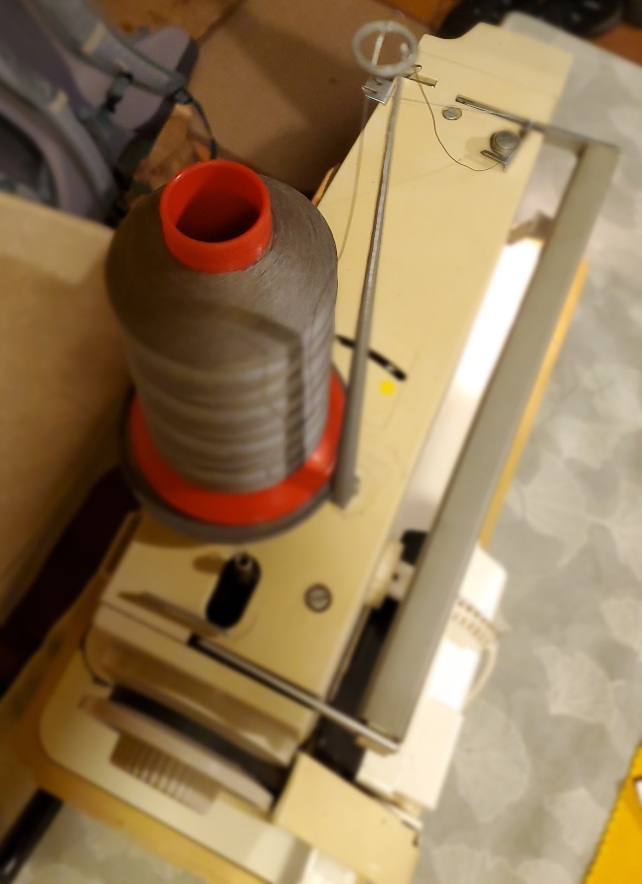 Sewing machine adapter for industrial sized spool