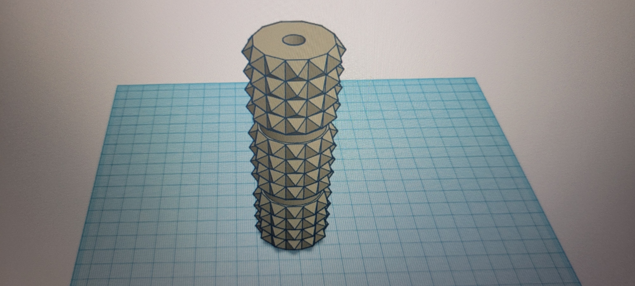 Spiked roller with cut out for stronger metal axle